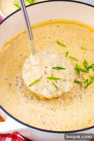 A ladle of cheesy cheeseburger soup.