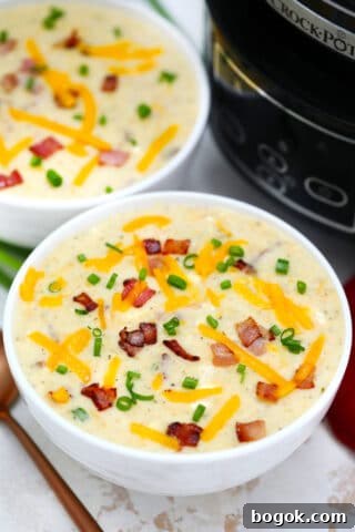 Slow Cooker Bacon Ranch Potato Soup gives a twist to the traditional version. It tastes amazing with the ranch flavor making it definitely worth a try! #soup #crockpotrecipes #slowcookerrecipes #sweetandsavorymeals #souprecipes