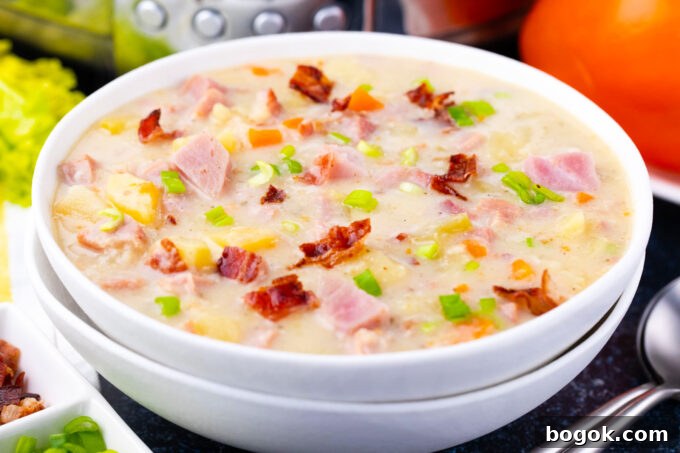 Creamy Slow Cooker Ham & Potato Soup Recipe 3 A bowl of creamy slow cooker ham and potato soup with bacon.
