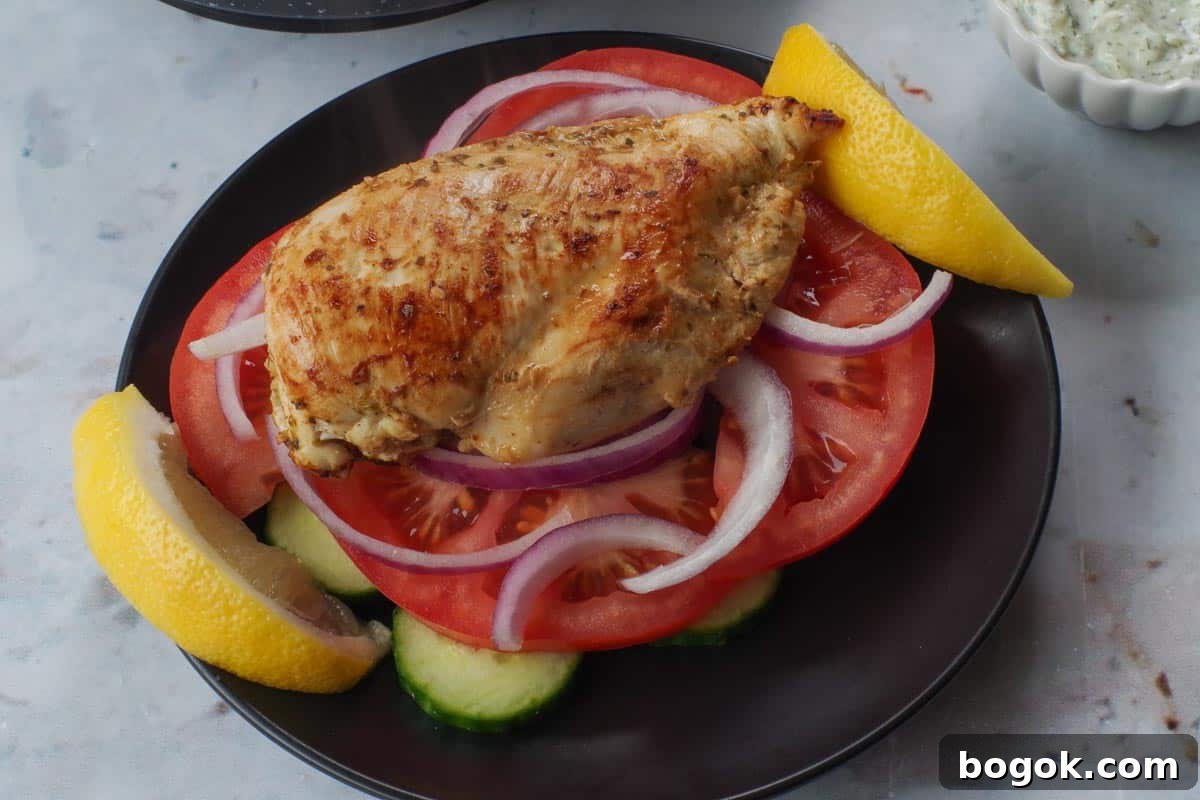 Greek Chicken Souvlaki Without Skewers — Weight Watchers Recipe 11 Chicken breast on top of bed of vegetables.
