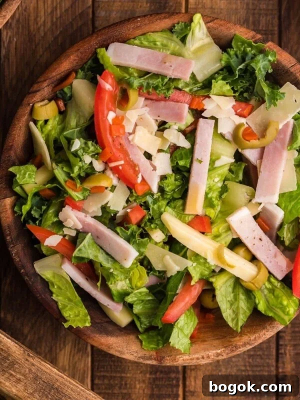 picture of julienne kale salad in a bowl on a table