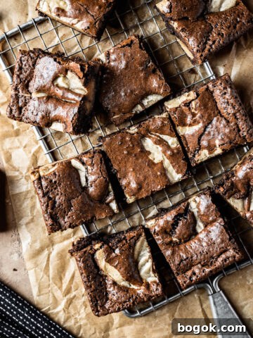 Brownie blondie squares casually arranged on a cooling rack
