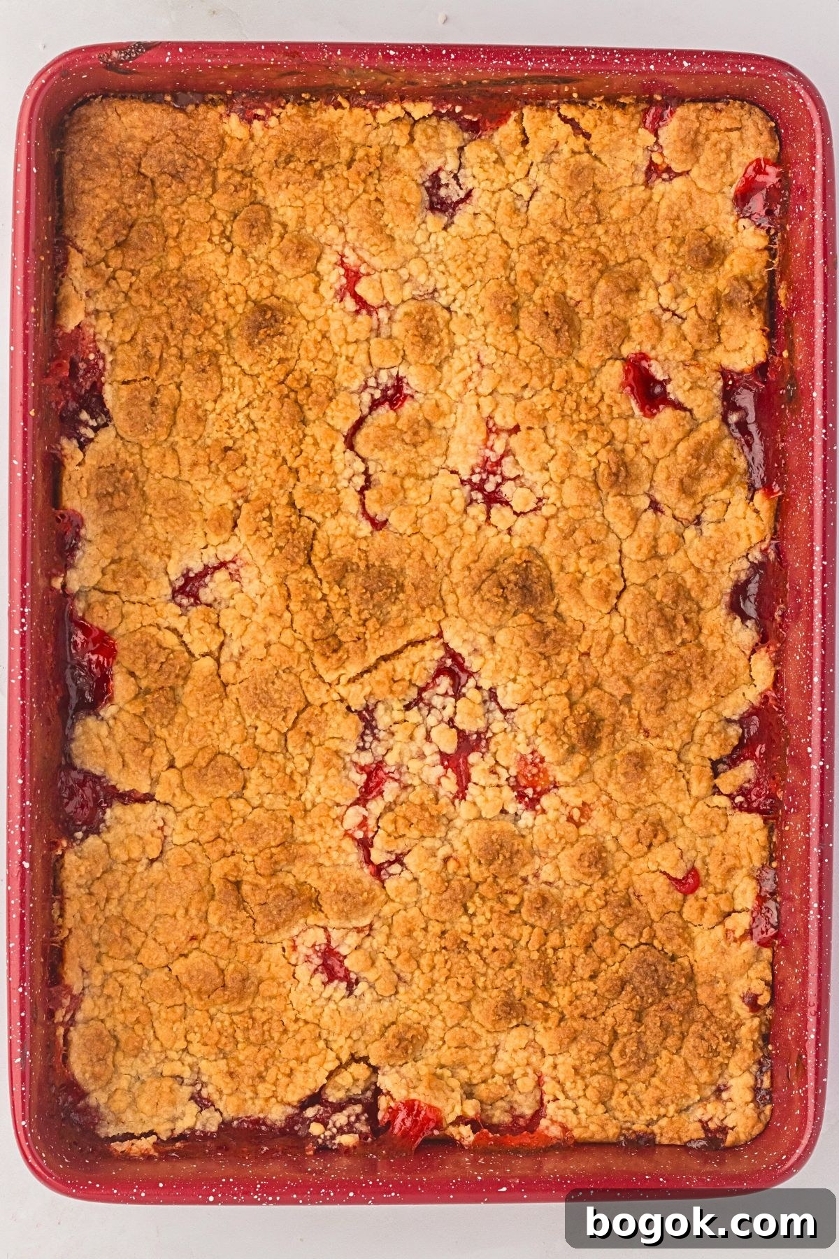 Golden and bubbly dump cake in a baking pan. 