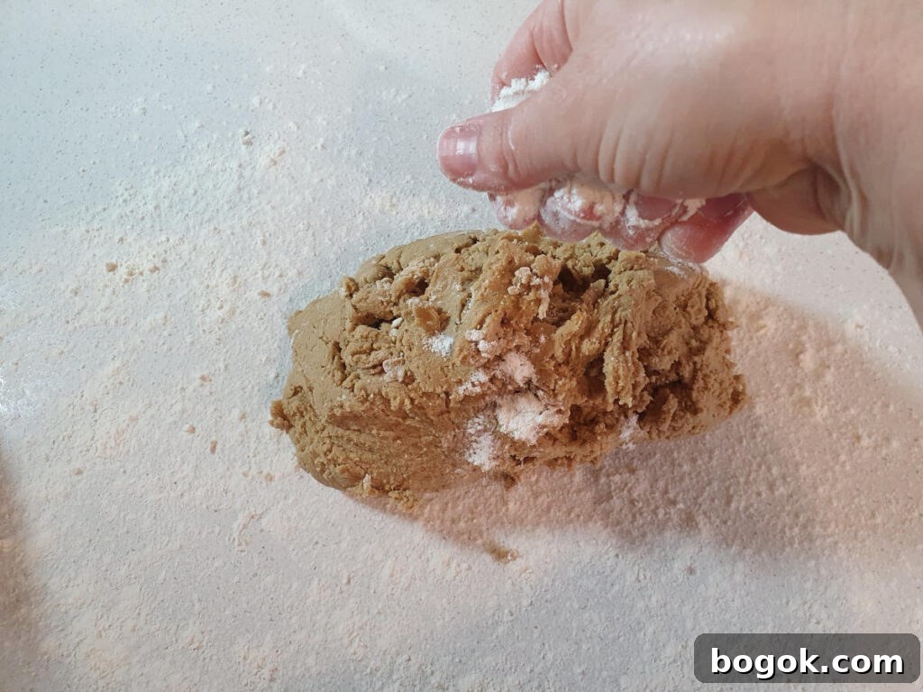 sprinkling dough with flour to prevent sticking when rolling out.