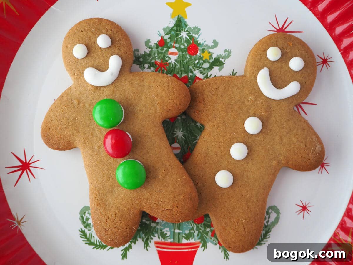 pair of gingerbread men on a Christmas plate.