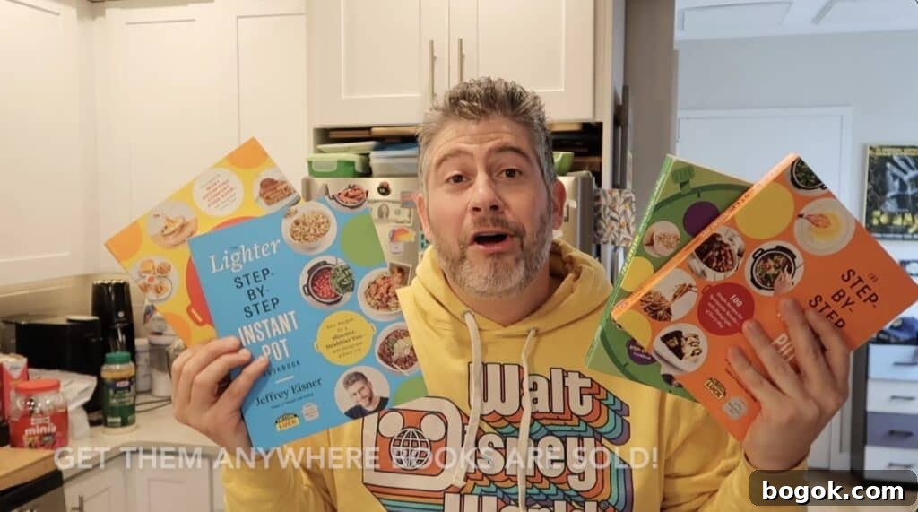 Garlic Herb Cheese Pasta Made in the Instant Pot 15 Man holding up 4 cookbooks he wrote