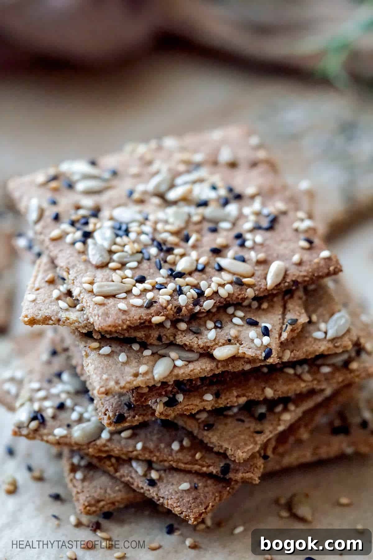 Keto crackers recipe without cheese. These homemade keto low carb crackers are made with healthy fats, a variety of seeds and grain free flour (tigernut or almond flour). These keto crackers recipe is also vegan (dairy free) and easy to make. #keto #crakers #lowcarb #seedcrackers #ketocrackers #vegan