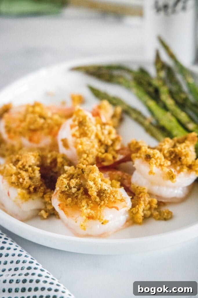 crispy baked shrimp on a plate with asparagus