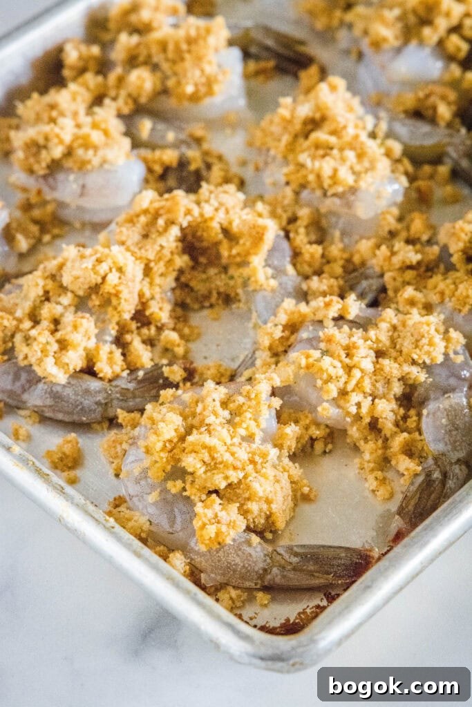 shrimp topped with breadcrumb mixture ready for the oven