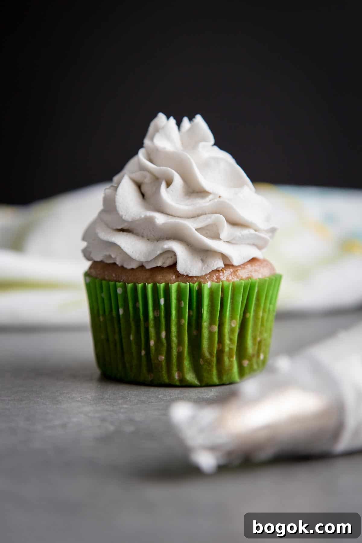 Coconut Whipped Cream on top of a cupcake.