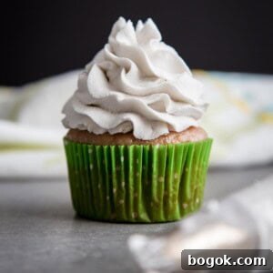 Coconut Whipped Cream on top of a cupcake.