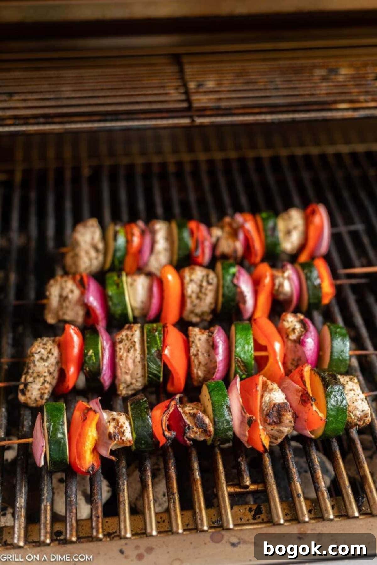 Grilled pork kabobs on the grill grates