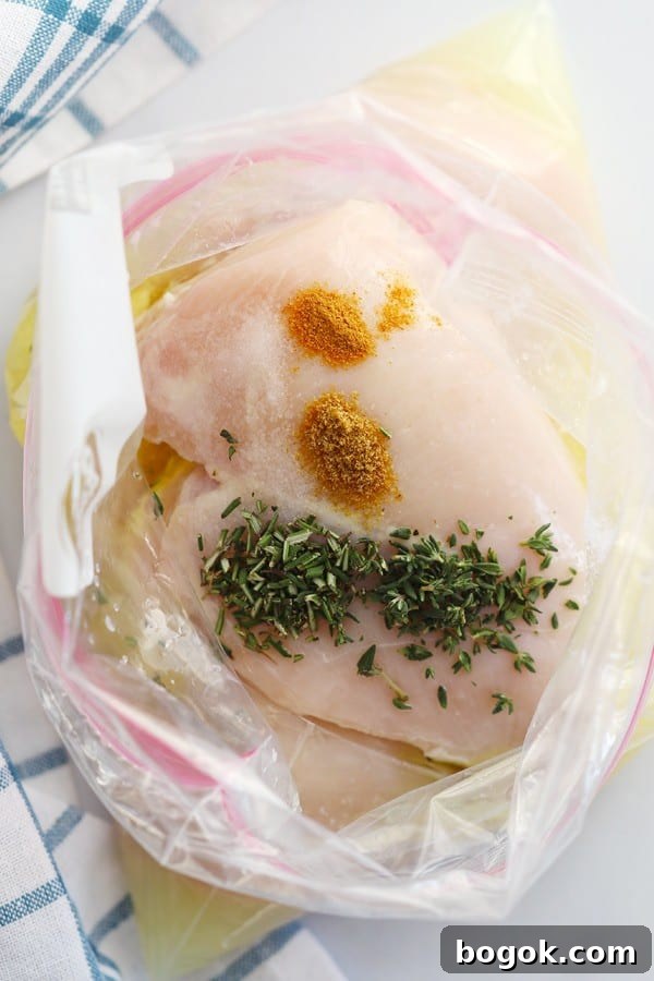 Chicken breasts in a freezer bag ready to marinate before making this easy baked lemon chicken breast recipe.