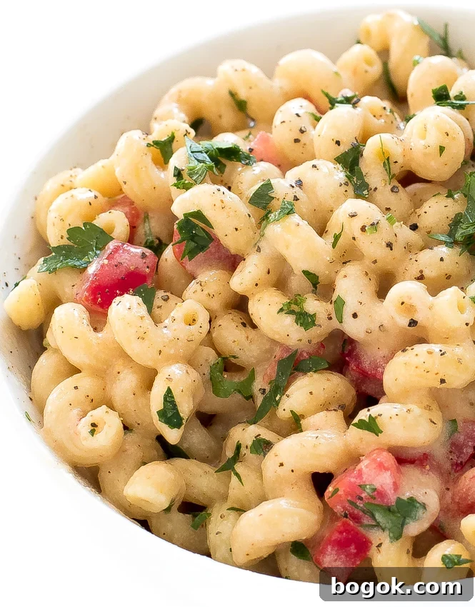 Pepper jack macaroni and cheese in white bowl.