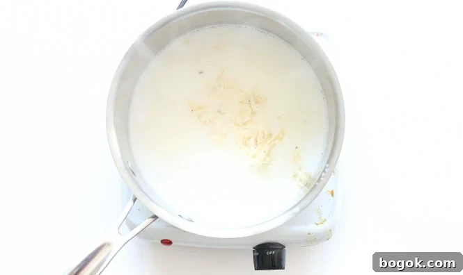 Cheese sauce in a saucepan.