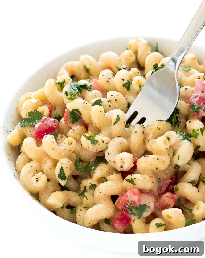 Spicy Pepper Jack Mac and Cheese in bowl with fork.