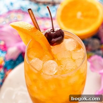 Classic Amaretto Sour Cocktail Recipe with a Citrus Twist 13 Close up angled photo of a glass with an amaretto sour.
