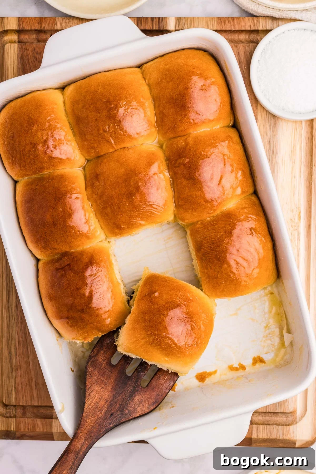 Flaky Honey Butter Dinner Rolls for Soft, Buttery Slices 8 honey butter dinner rolls in a dish
