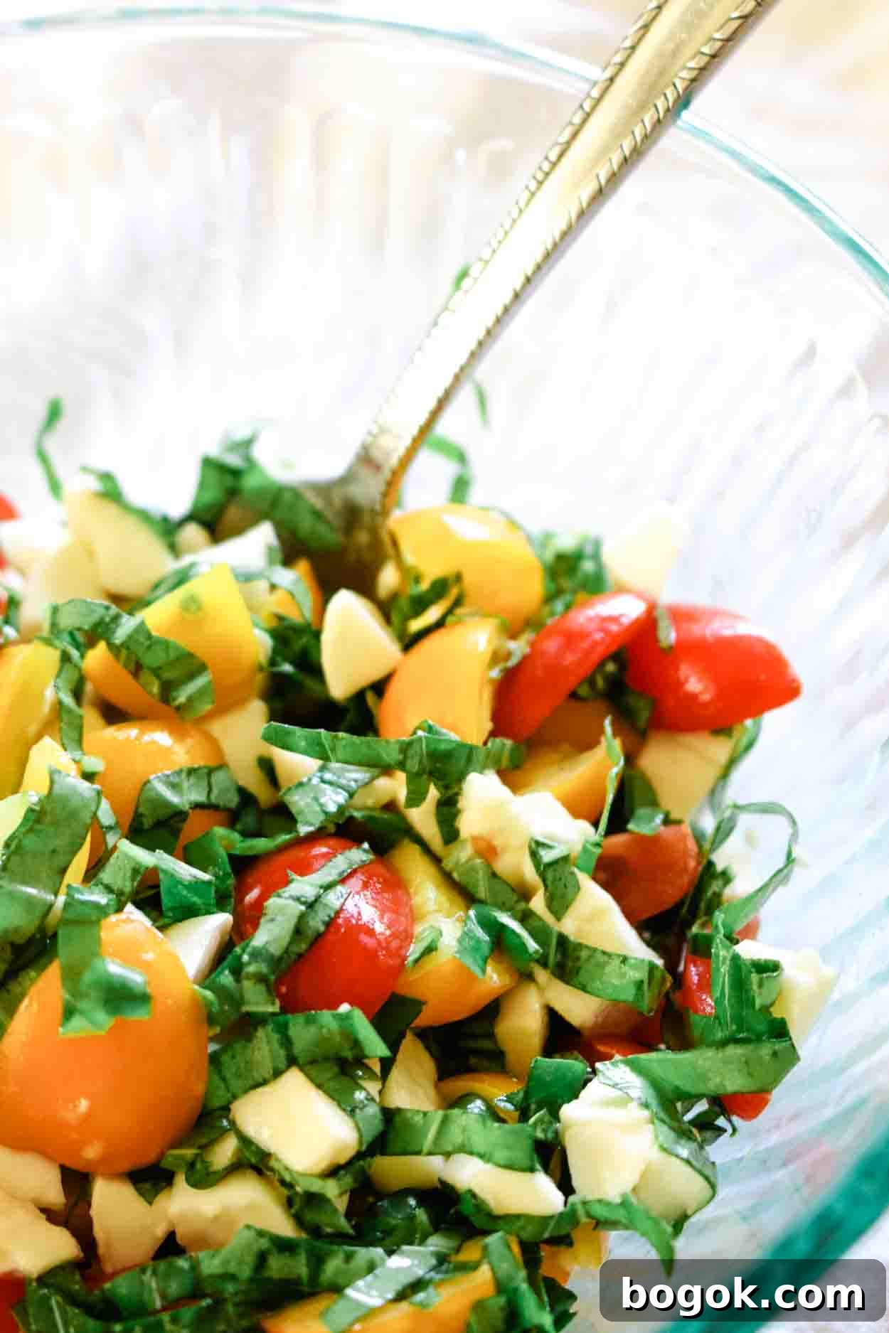 Caprese-Stuffed Avocados with 5 Ingredients 4 Caprese salad in a bowl with cherry tomatoes, fresh mozzarella and basil.