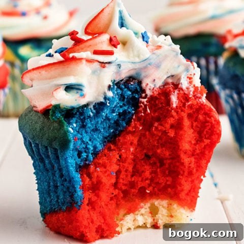 red white and blue cupcake with bite taken out
