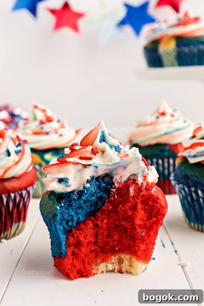 red white and blue cupcake with a bite missing.