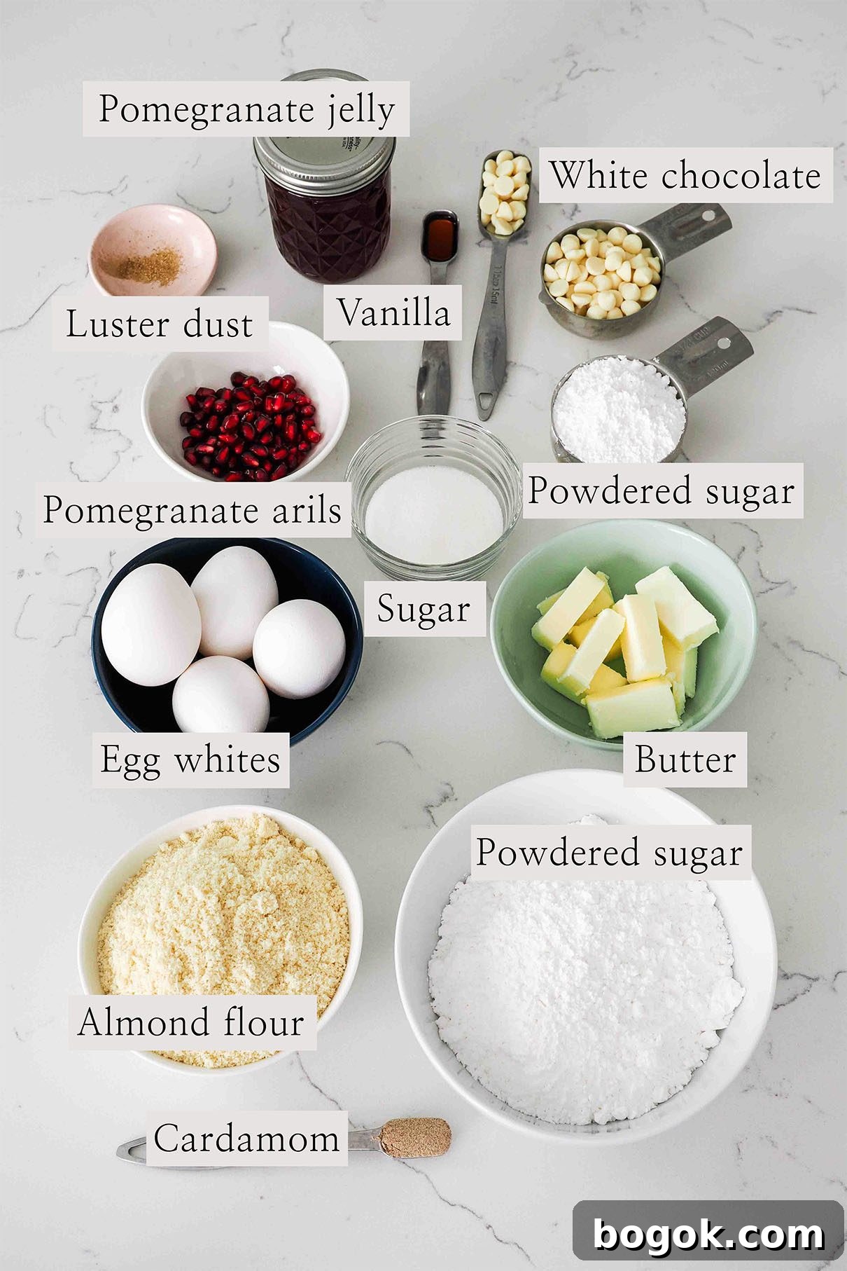 White Chocolate and Pomegranate Macarons — Recipe & Tips 3 Ingredients for white chocolate pomegranate macarons on a counter.