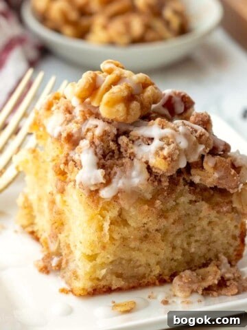 Baked banana coffee cake on plate with fork.