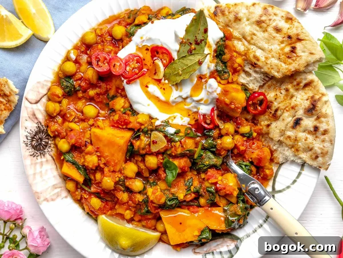 40 Delicious Chickpea Recipes for Every Meal and Occasion 13 Chickpea stew with yogurt and chili oil on a plate with flowers