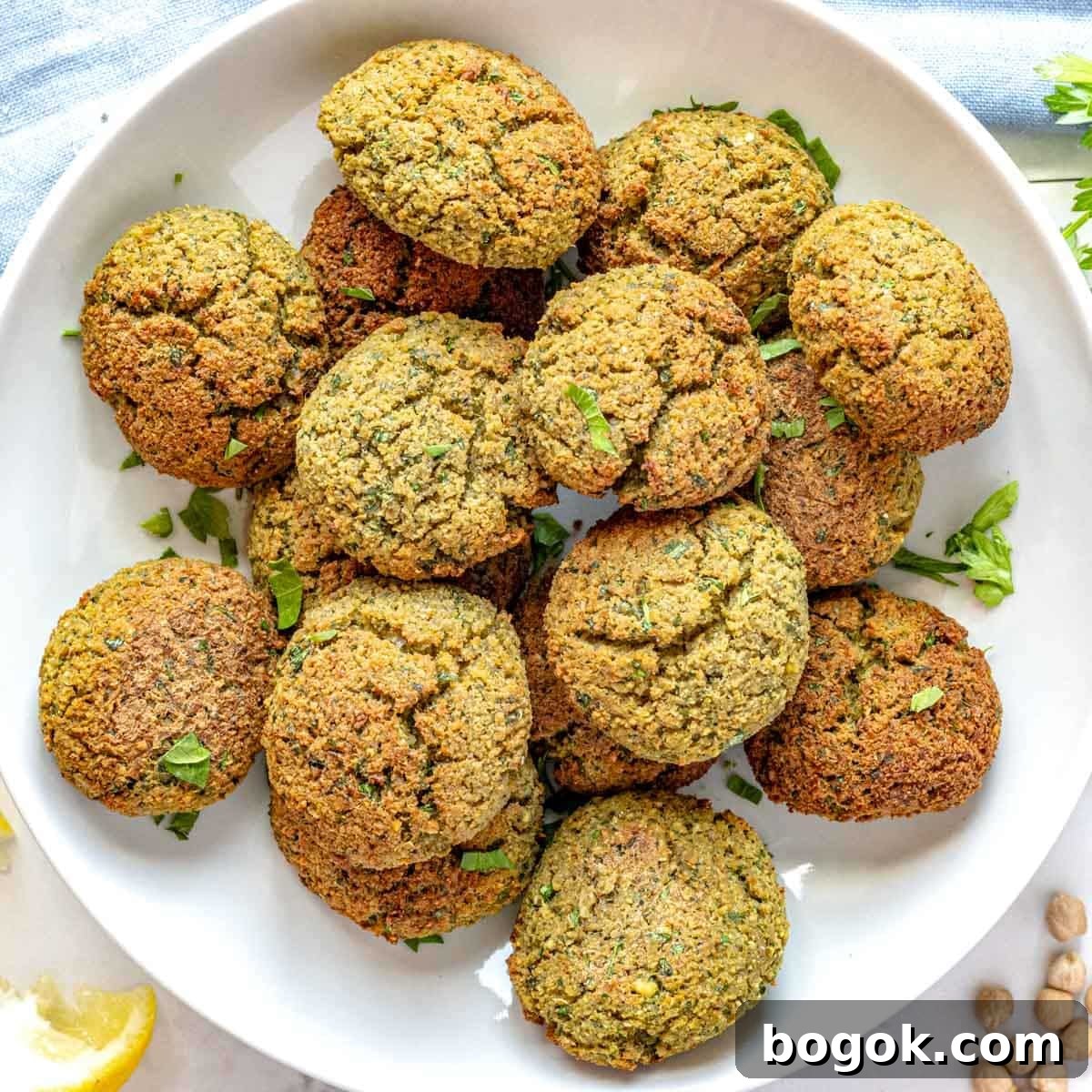 40 Delicious Chickpea Recipes for Every Meal and Occasion 3 Falafel balls in a bowl with fresh parsley.