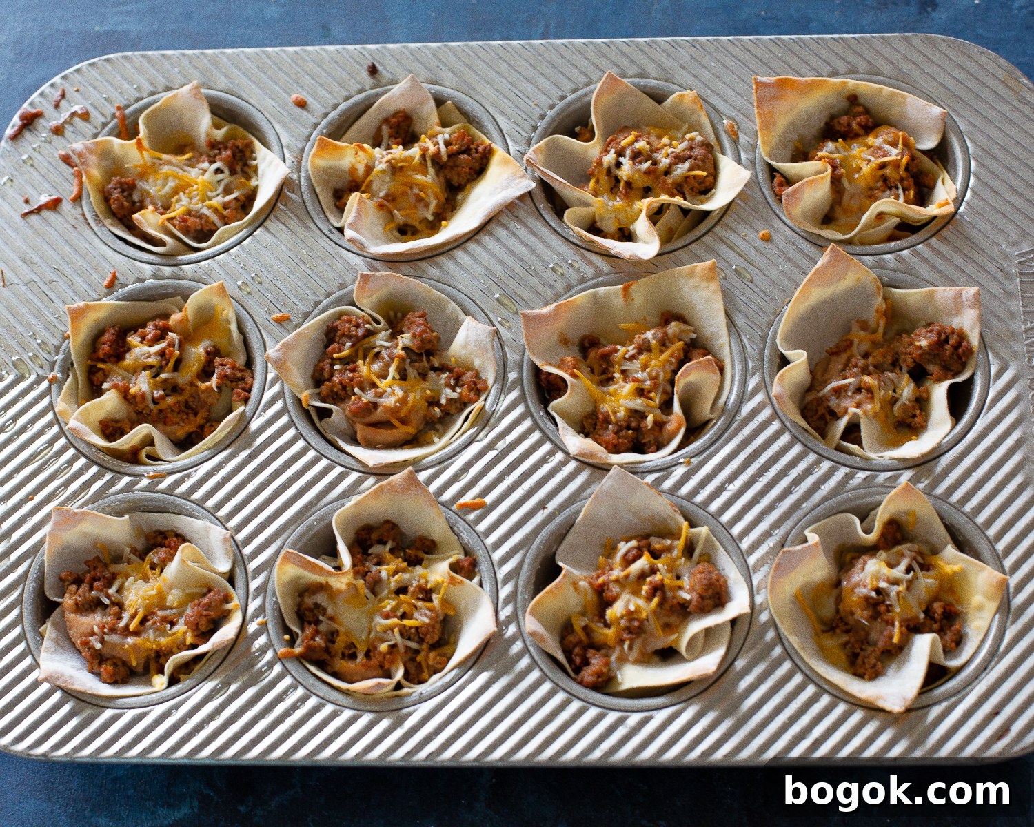 Crispy Taco Cups: A Simple Party-Ready Appetizer 7 wonton wrappers with beans and cheese