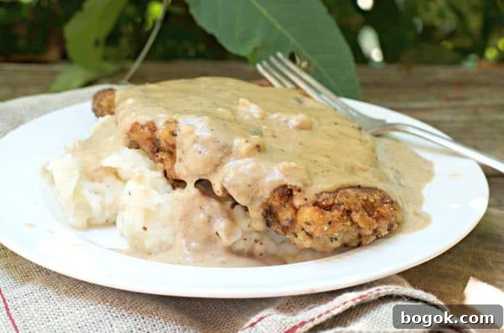 The Secret to Perfect Chicken Fried Steak with sunlight shining on the gravy