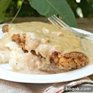 The Secret to Perfect Chicken Fried Steak with sunlight shining on the gravy