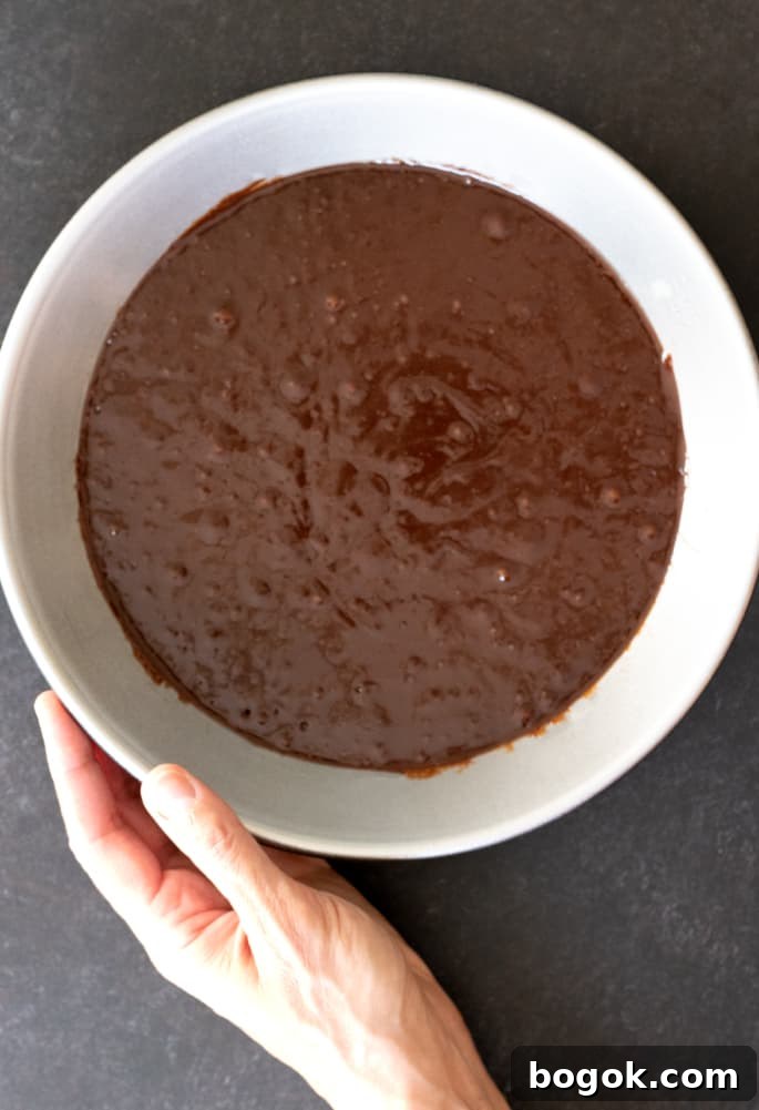 Overhead image of raw brownie batter in pie plate.