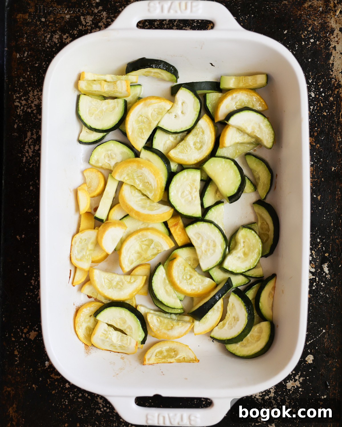 roasted summer squash in white baking dish