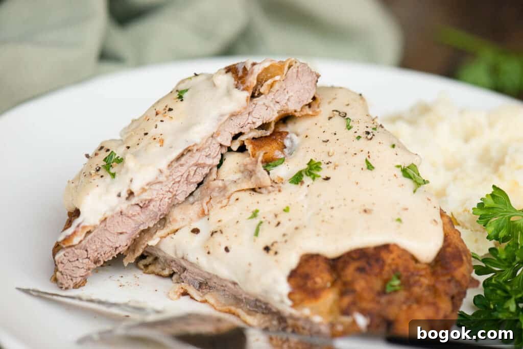Chicken fried steak cut in half
