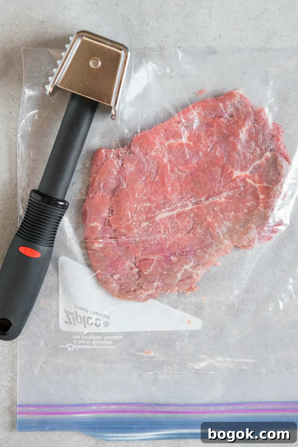 tenderized round steak in plastic bag