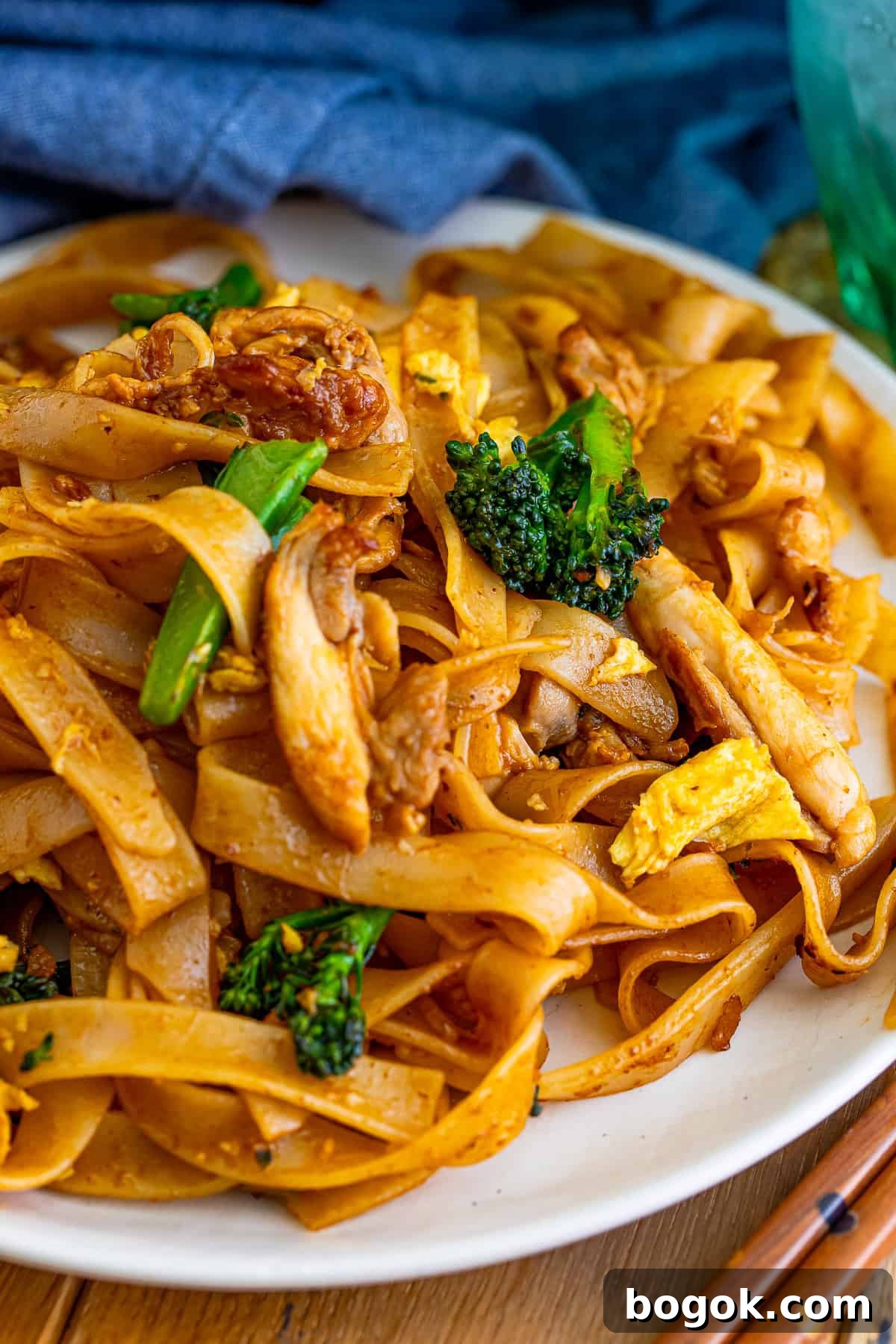 Thai Pad See Ew served on a white plate