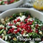 Winter Kale and Pomegranate Salad with Citrus Vinaigrette 12 close up of kale salad topped with pomegranate seeds