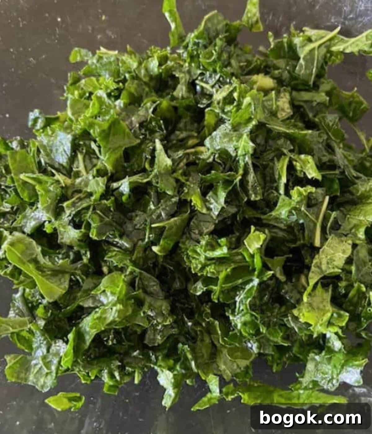 Winter Kale and Pomegranate Salad with Citrus Vinaigrette 4 Massaged kale in bowl.