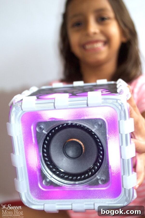 Children building and enjoying a Bluetooth speaker