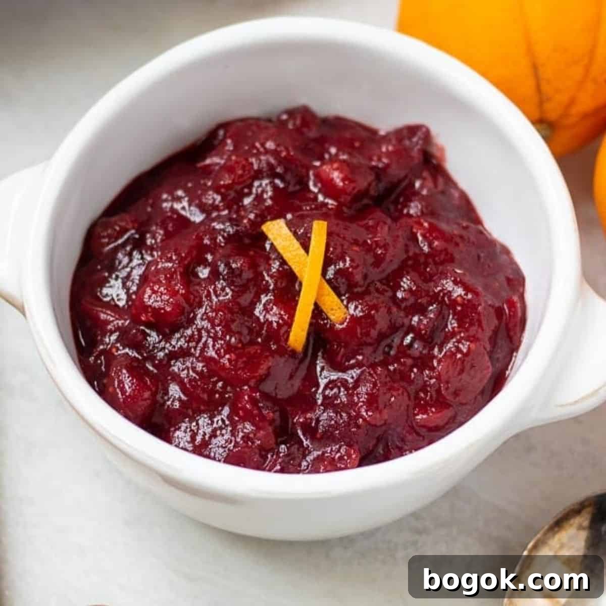 Easy Recipes for Thanksgiving Dinner Bowl of Cranberry Orange Sauce with Orange zest.