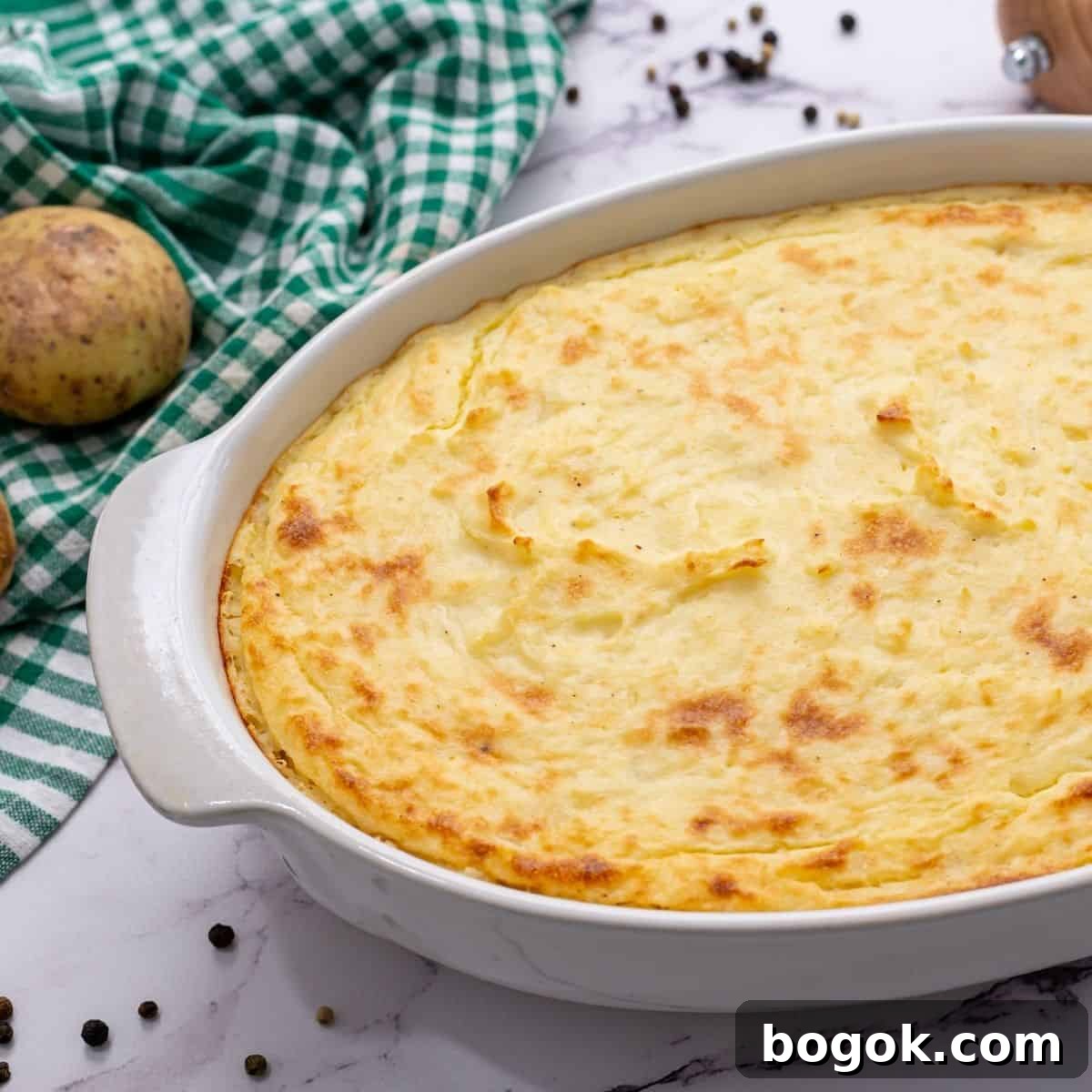 Thanksgiving Dinner Recipes Baked Mashed Potato Casserole in White Casserole Dish