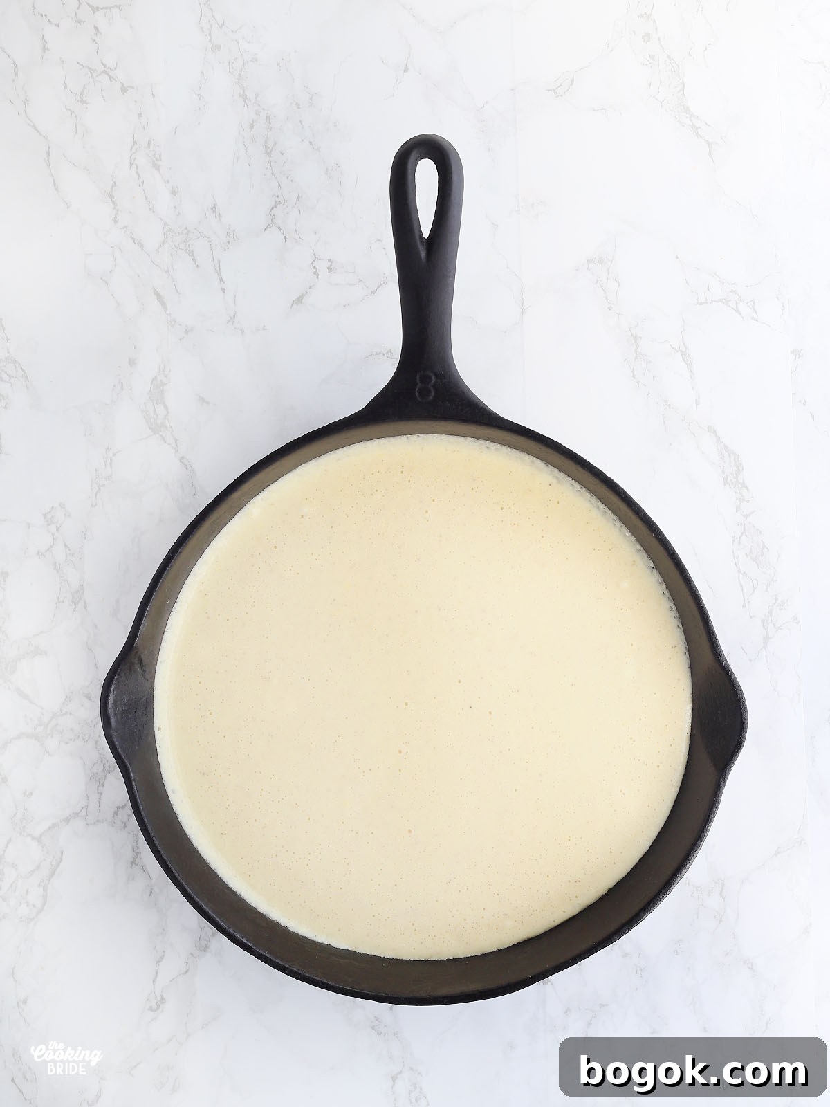 Classic Southern Skillet Cornbread Recipe for Crispy Golden Crust 12 Cornbread batter in a cast iron skillet before putting it in the oven.