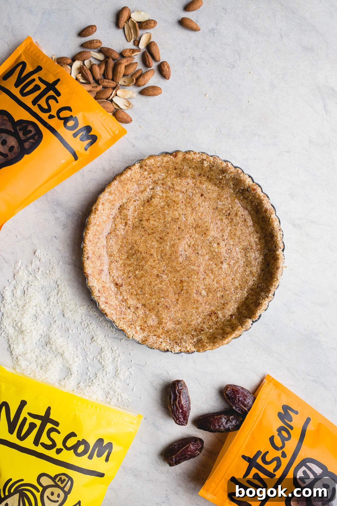 This No-Bake Coconut Cream Pie is made with a sprouted almond press-in crust, coconut milk pudding filling, and topped coconut cream and toasted shredded coconut. Gluten-free, vegan.