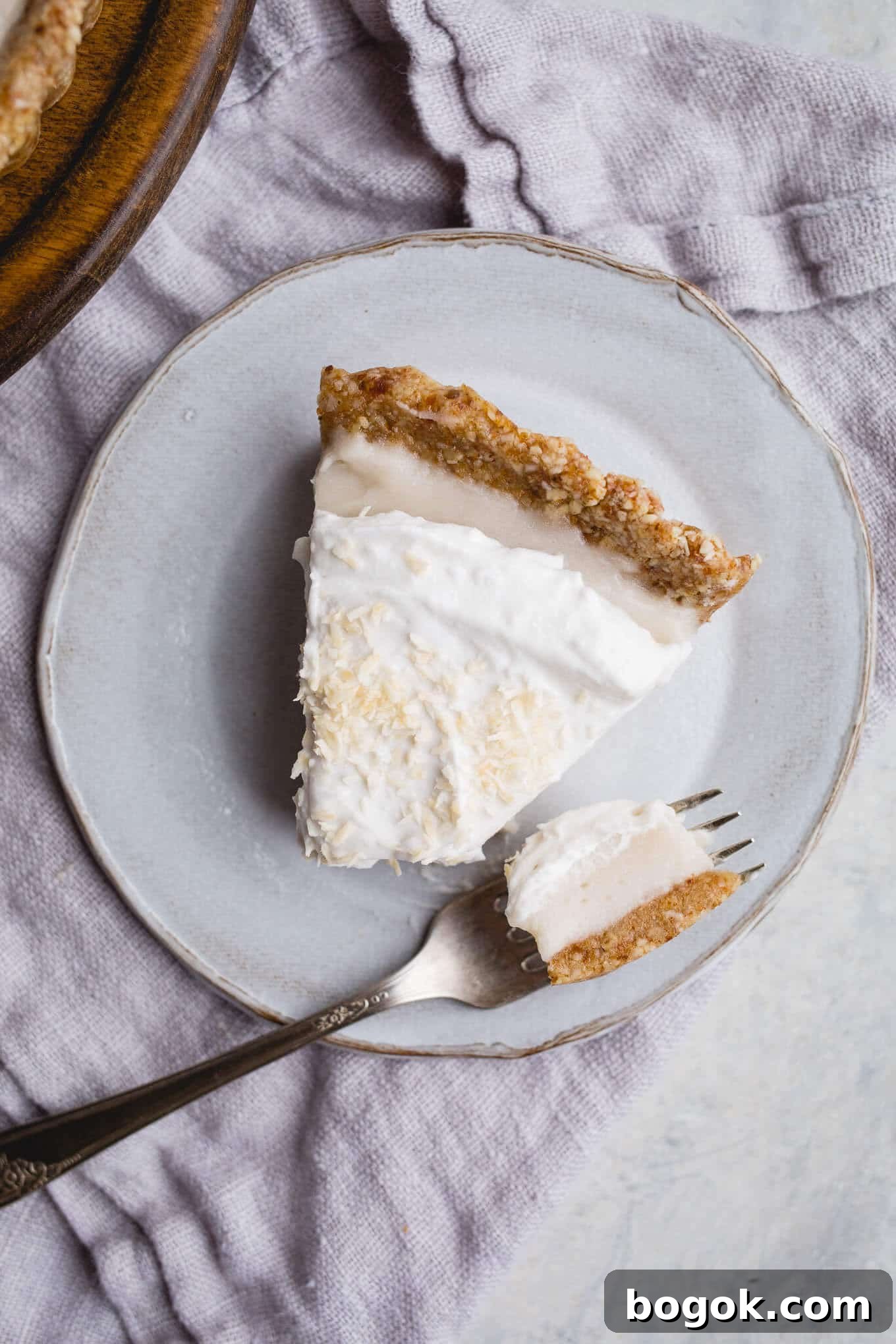 This No-Bake Coconut Cream Pie is made with a sprouted almond press-in crust, coconut milk pudding filling, and topped coconut cream and toasted shredded coconut. Gluten-free, vegan.