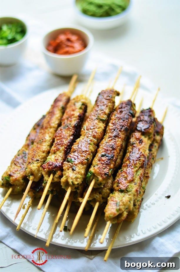 Authentic Chicken Seekh Kebab Recipe: Juicy Grilled Skewers 2 Chicken Seekh Kabab stacked on a white plate