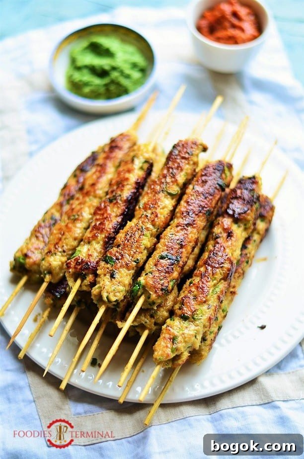 Authentic Chicken Seekh Kebab Recipe: Juicy Grilled Skewers 4 chicken seekh kabab on bamboo skewers on a big pile