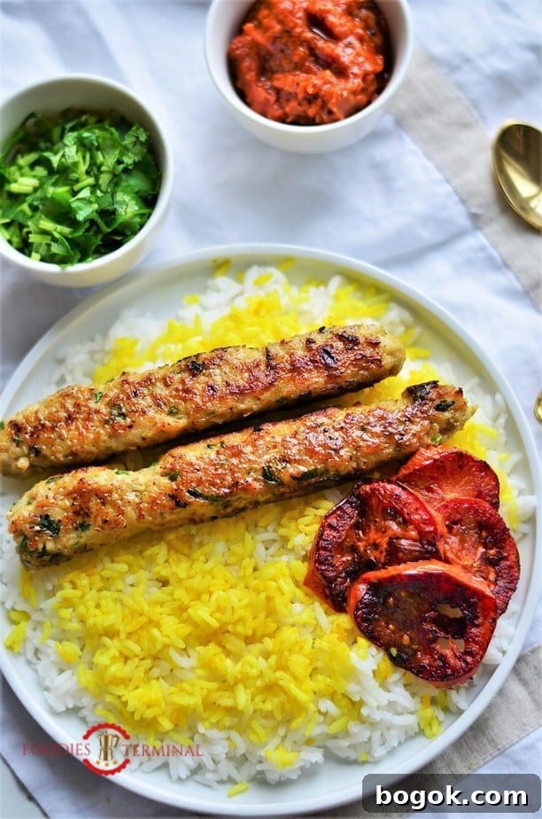 Authentic Chicken Seekh Kebab Recipe: Juicy Grilled Skewers 7 Chicken seekh kabab over saffron rice & roasted tomato wedges