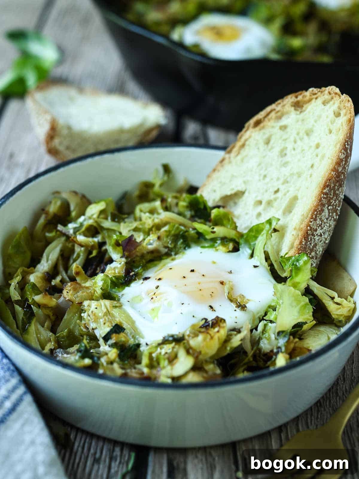 Crispy Brussels Sprout Hash with Bacon and Caramelized Onions 11 Brussel spout hash in a mini skillet with eggs and toast.