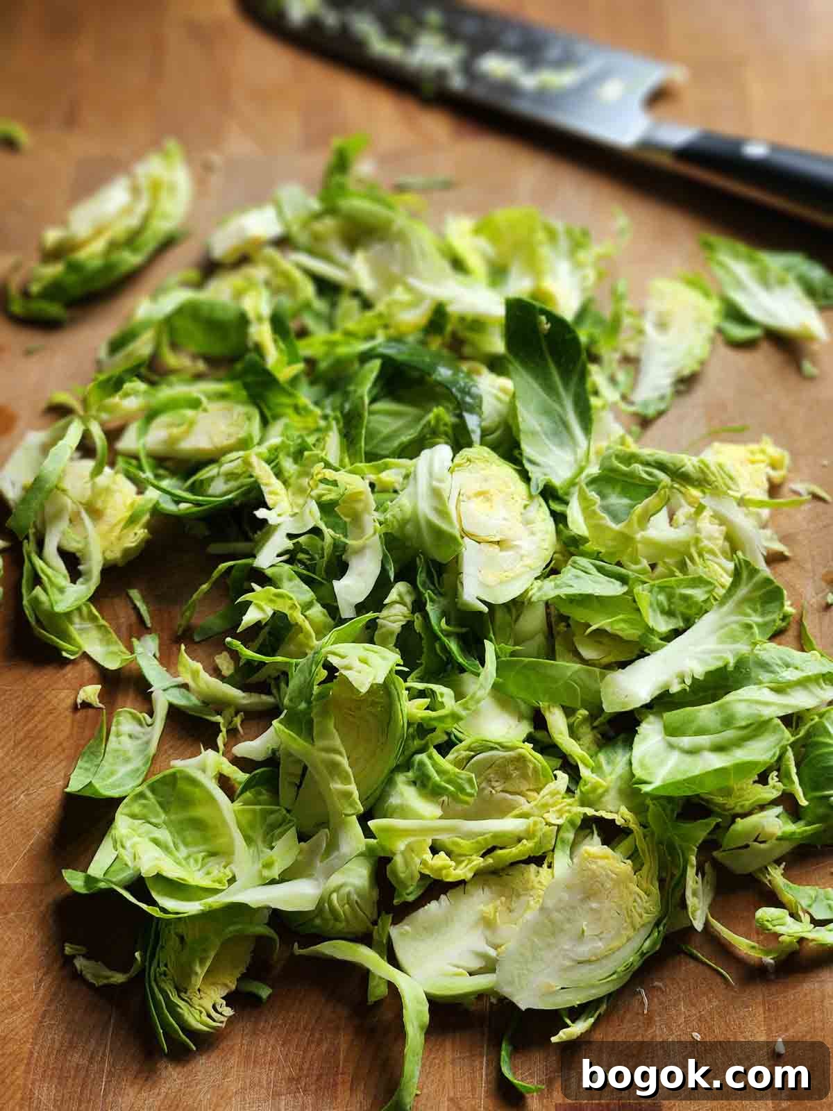 Crispy Brussels Sprout Hash with Bacon and Caramelized Onions 5 Shredded Brussel sprouts n a cutting board.